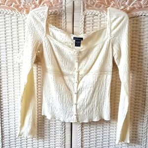 Lace embellished cream top with pearl buttons